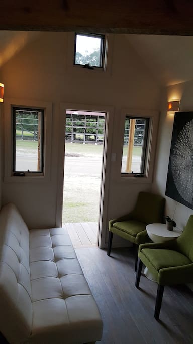 Little living space with original art and fold out futon. Pictured David Humphreys
