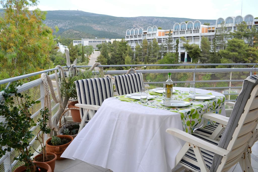 Dining set for your meal on the main-east balcony with splendid view