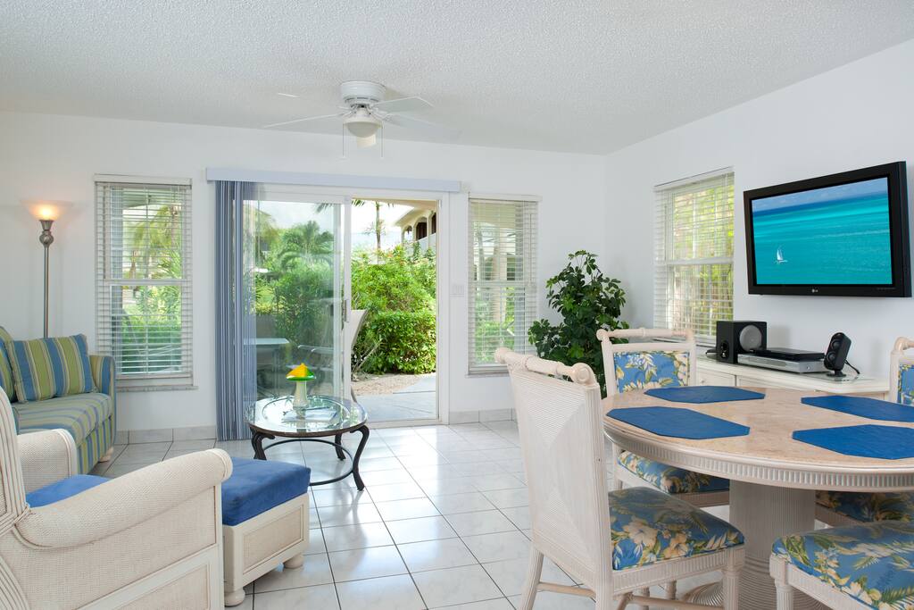 Living & dining area with patio doors to courtyard.