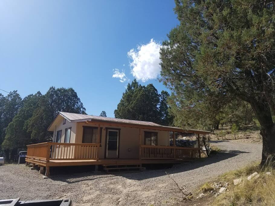 Drive through driveway, enter at the top, exit at the bottom, just three steps to the deck and the single level cabin.