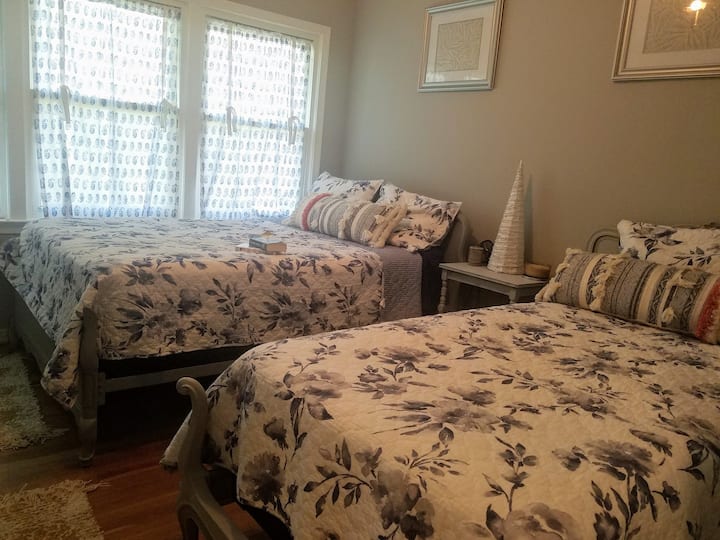 Bedroom #1 - The Silver Fern features 2 twin bed, and closet.