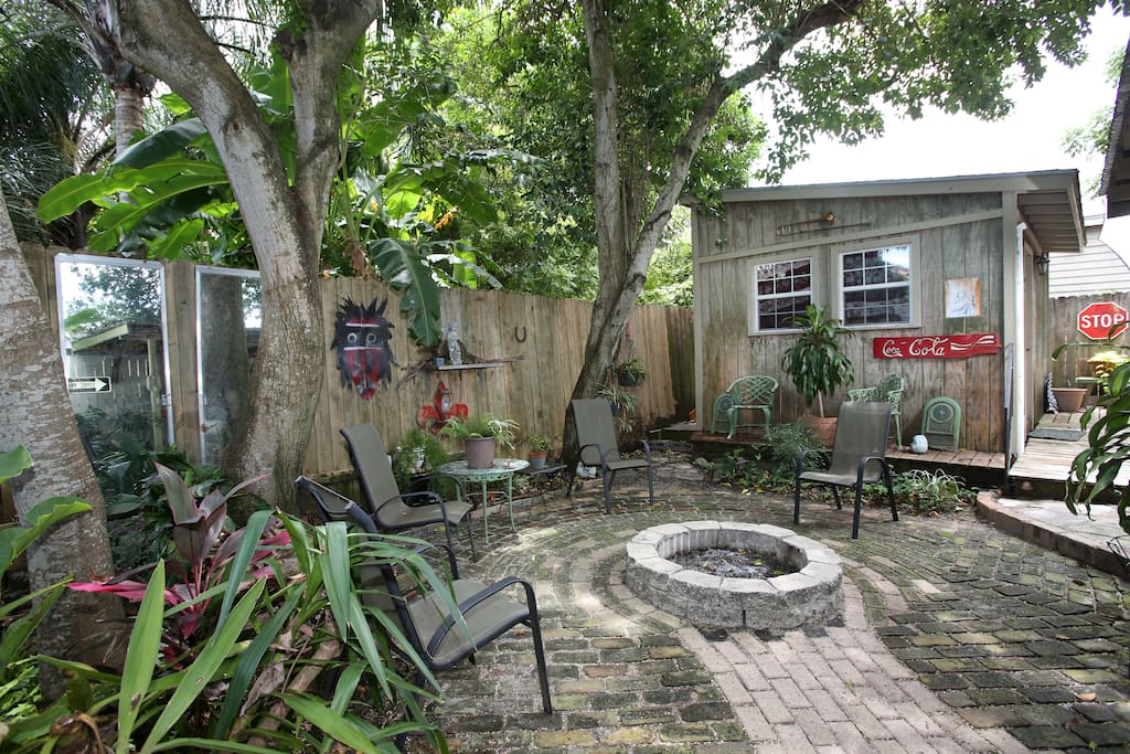 The back yard, fire pit and music room