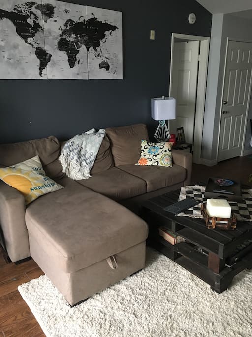 Living room couch can be pulled out to make into a full size bed. It's not as comfortable as an actual bed but would be suitable for children or just a few nights for an adult.