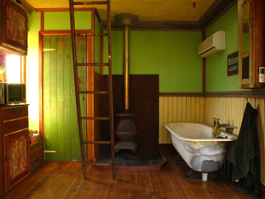Pot belly stove heater and cast iron bath.