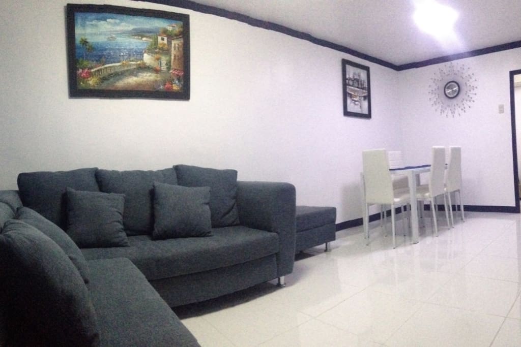 Great view of living and dining room with two paintings made by local artist. Call us at 09178506535
