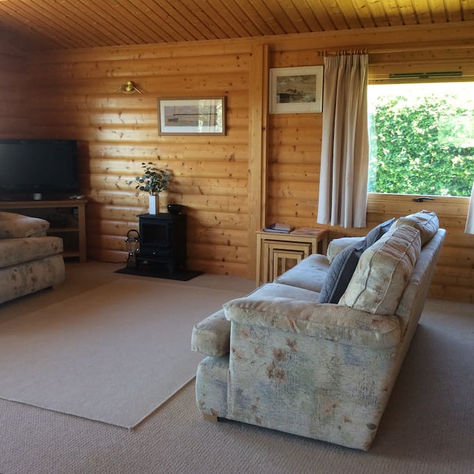 Spacious lounge area with TV.
