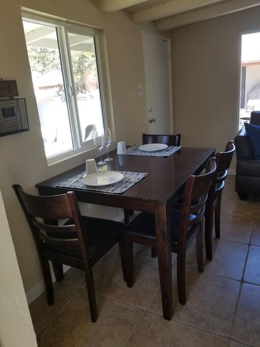 Enjoy dinner in this freshly lit dining area.