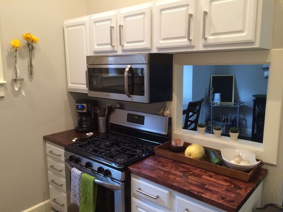 Full kitchen with beautiful butcher block counter tops!