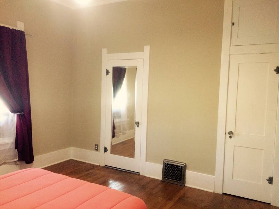 Front bedroom with jack and Jill bathroom door and closet door.