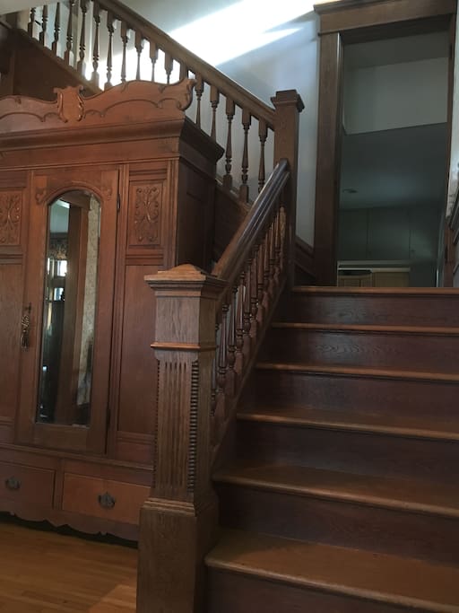 Unique two-way staircase with original wood work.