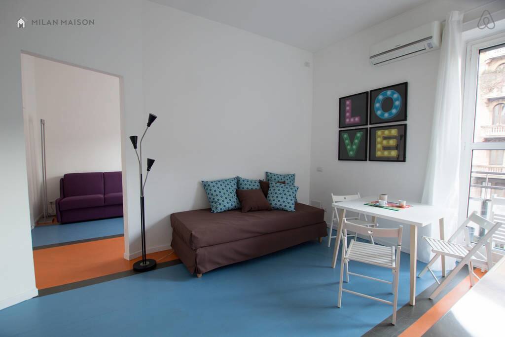 The bedroom on the left. The single bed and living room.