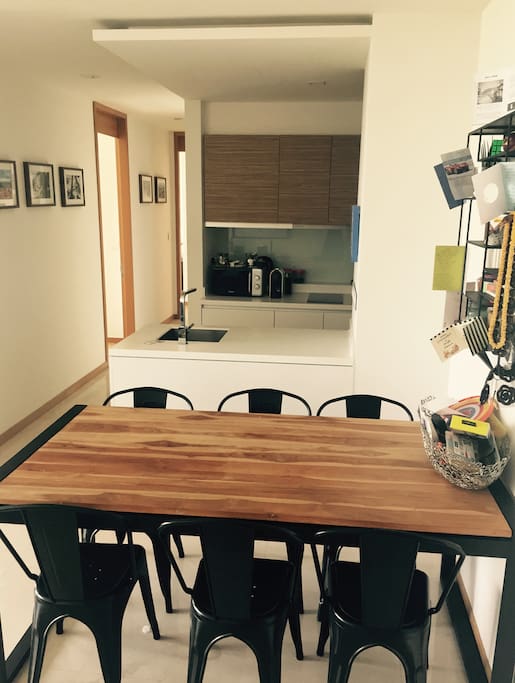 Large dining table and kitchen