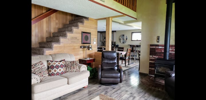 Livingroom with slider and big window to allow lake and mountain views