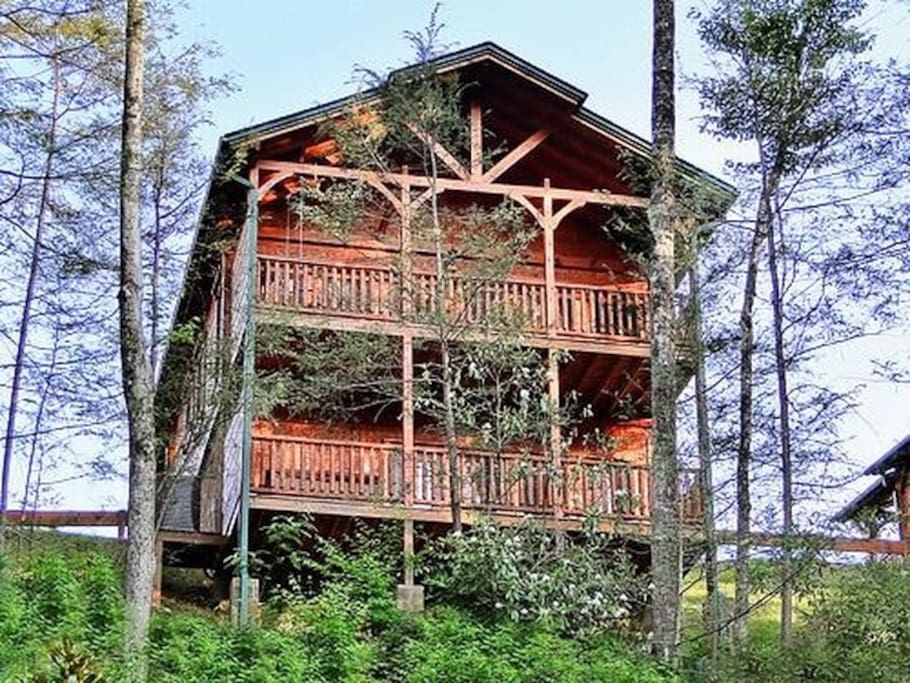 Two decks with rocking chairs - a hot tub on the lower deck and swing on the back upper dec
