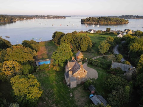 Waterfront mansion with heated pool