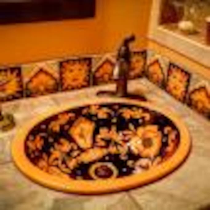Bath is adorned with colorful tiles from Mexico
