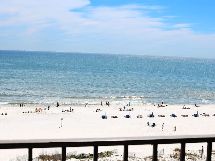View of beach while sitting on balcony