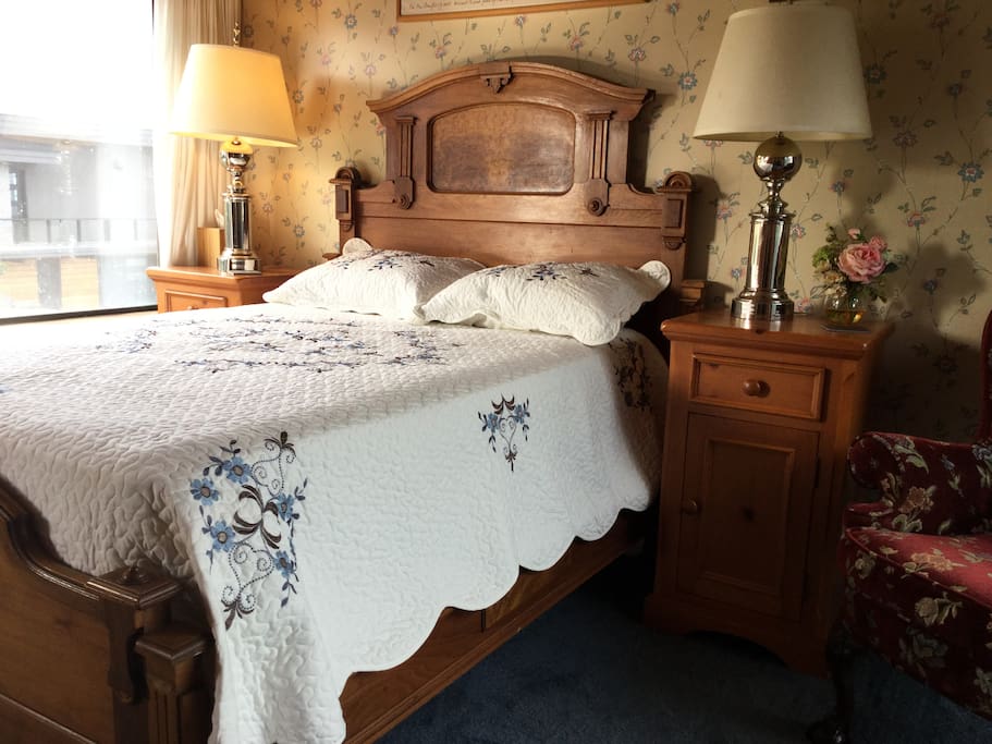 The bedroom with restoration hardware lamps on dimmers, and a drawer full of New Yorker, Atlantic and Harper's Magazines.