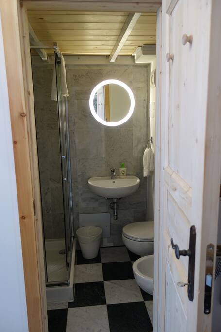 private bathroom with shower, toilet, bidet and sink