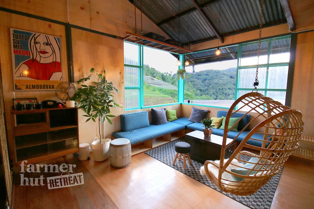 Cozy living room. Large windows open up to outdoor, allowing our guest fully interact with the landscape and views.