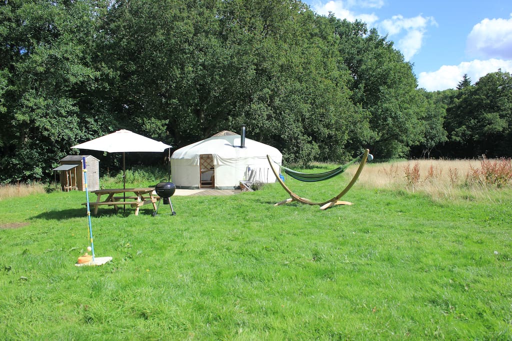 Oak Tree Yurt with a private outdoor space including a family sized hammock, picnic table, bbq and swing tennis