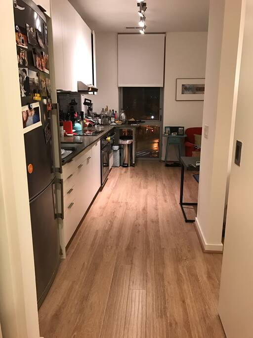 Hallway with door on right to bedroom