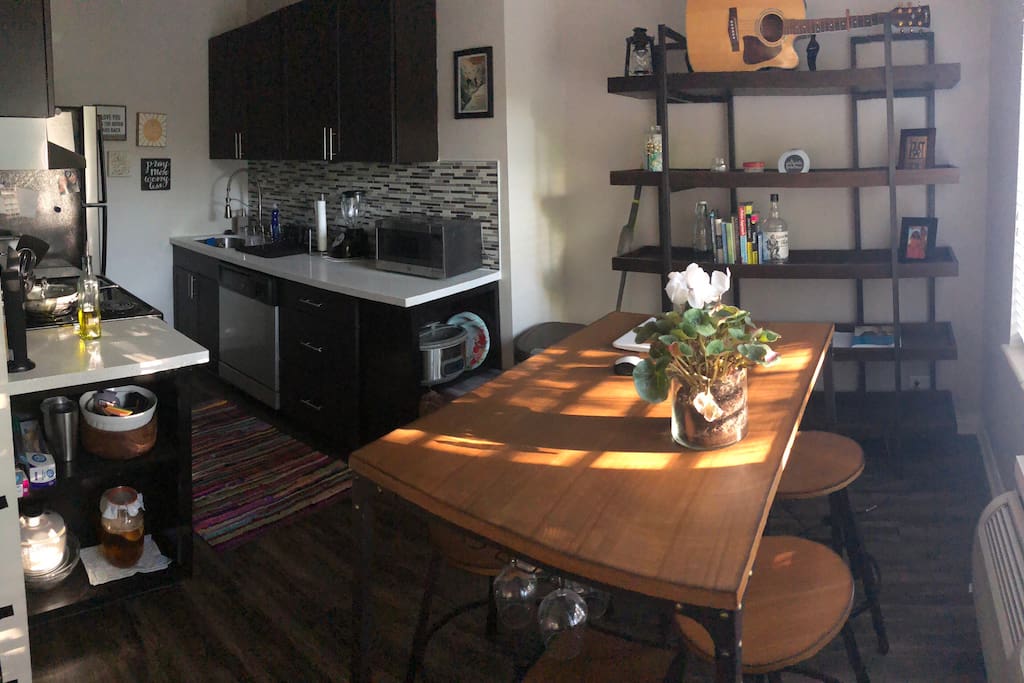 This is the kitchen which is right off the main living area. It has stove top, oven, refrigerator, microwave. The built in on the right underneath the microwave will be cleared for you to store pantry items in.