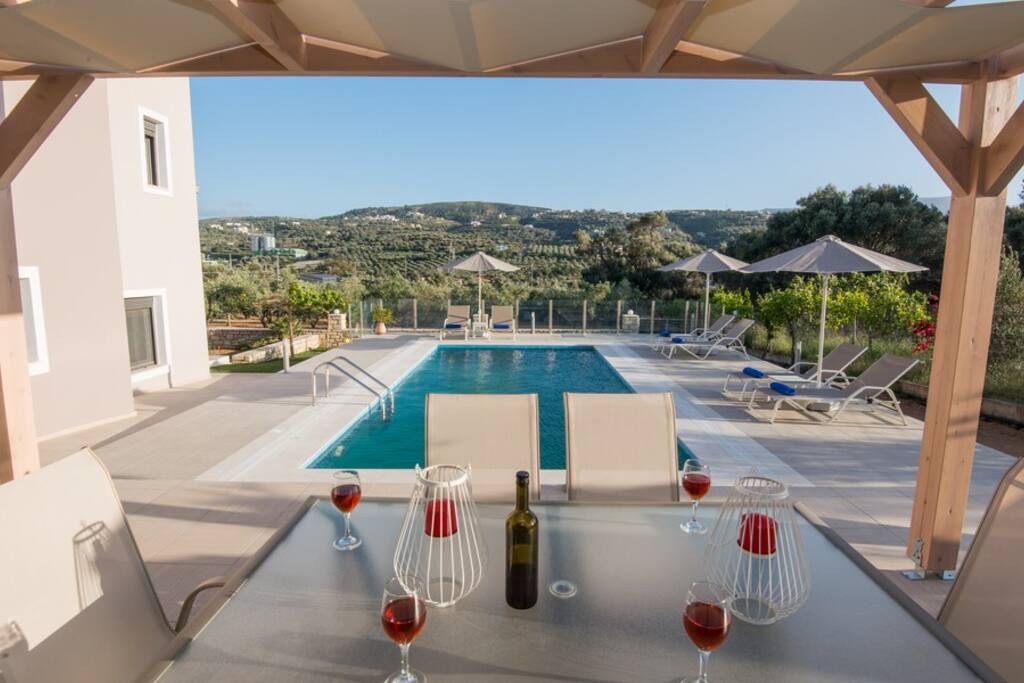Shaded dining area next to the pool and BBQ!