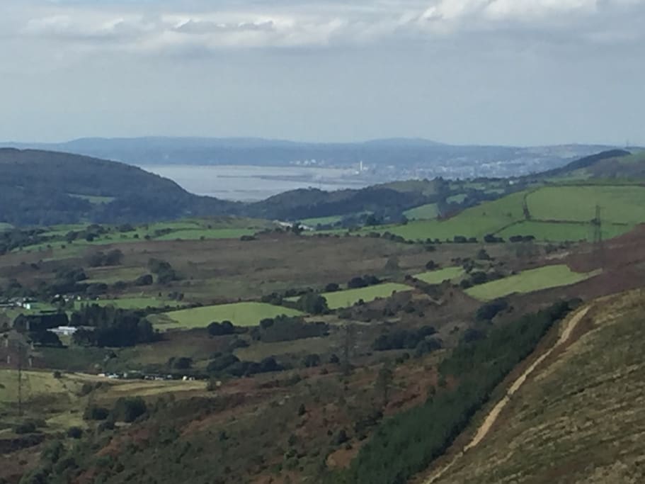 View from footpath up hill behind house