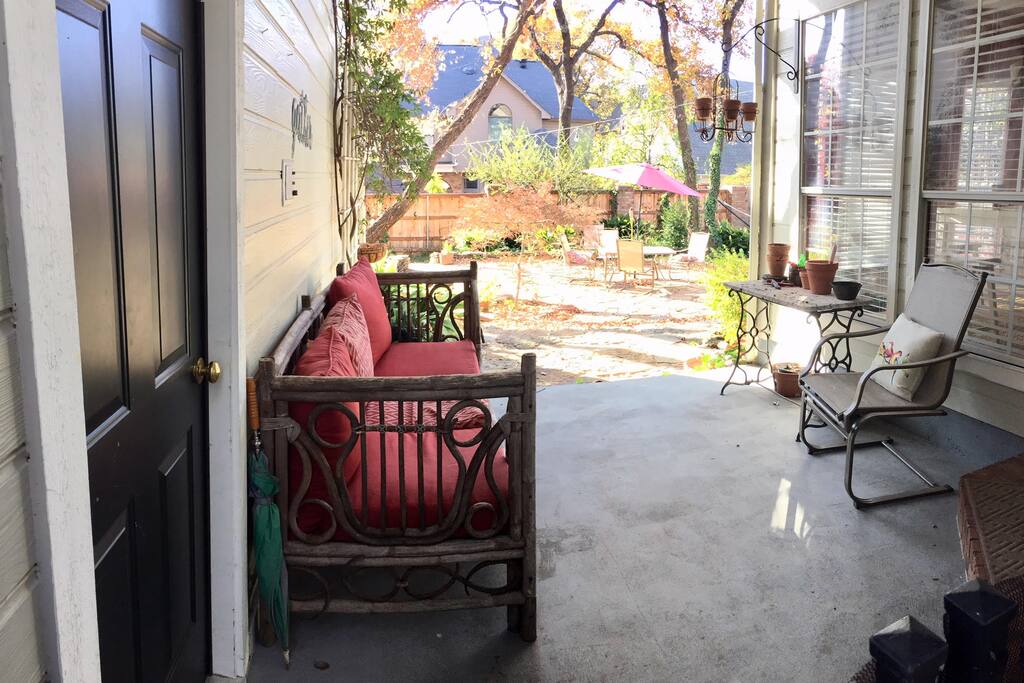 Entrance from the walkway to the breezeway. Black door to the left is garage entrance.