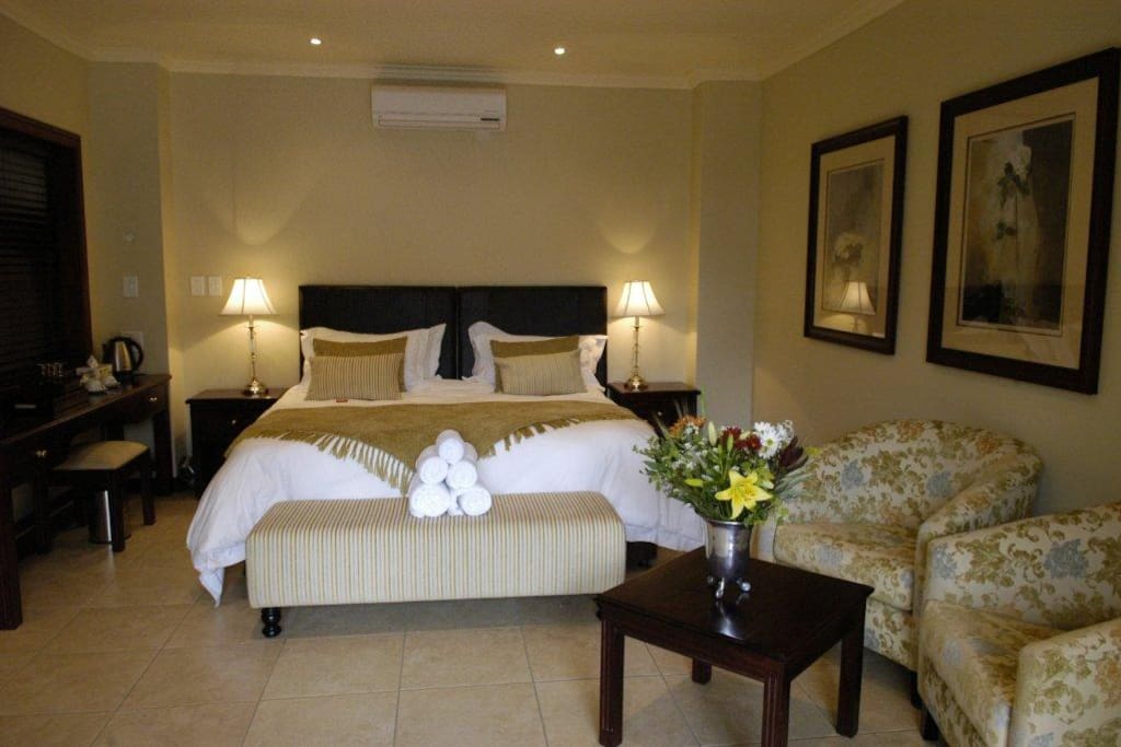 Luxury Standard Suites, en-suite bathroom, air-con, TV, bar fridge, kettle with coffee, tea and rusks.
Sleeps 2 adults. Can be setup as 2 x singles or 1 x double bed. Extra cost on arrival for mattress on the floor for maximum 2 children u/10 years of age.