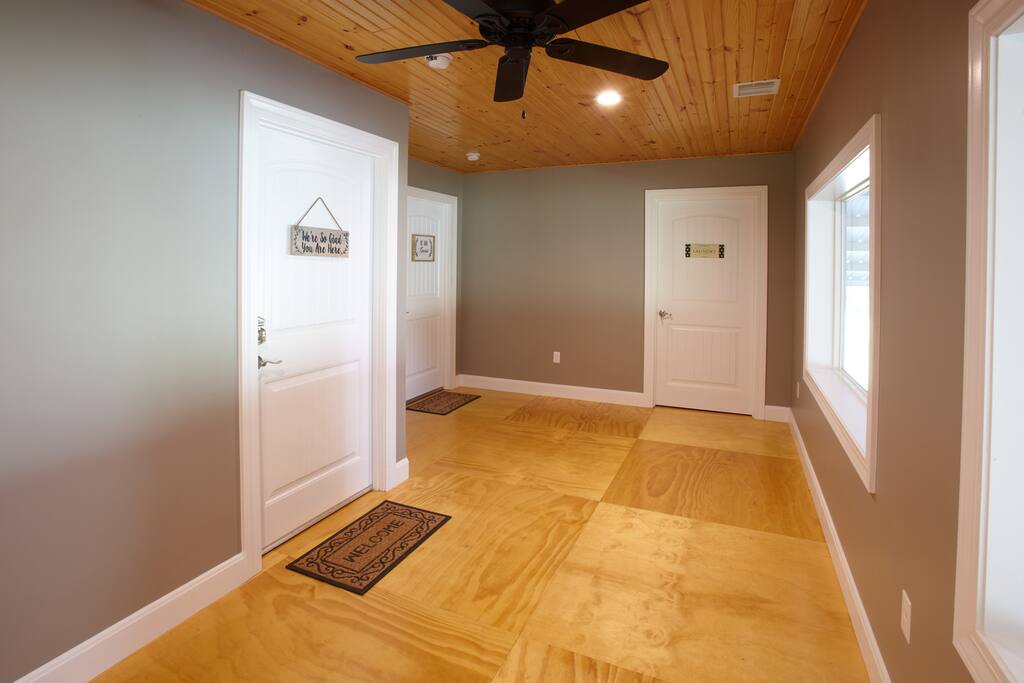Hallway to apartments and laundry