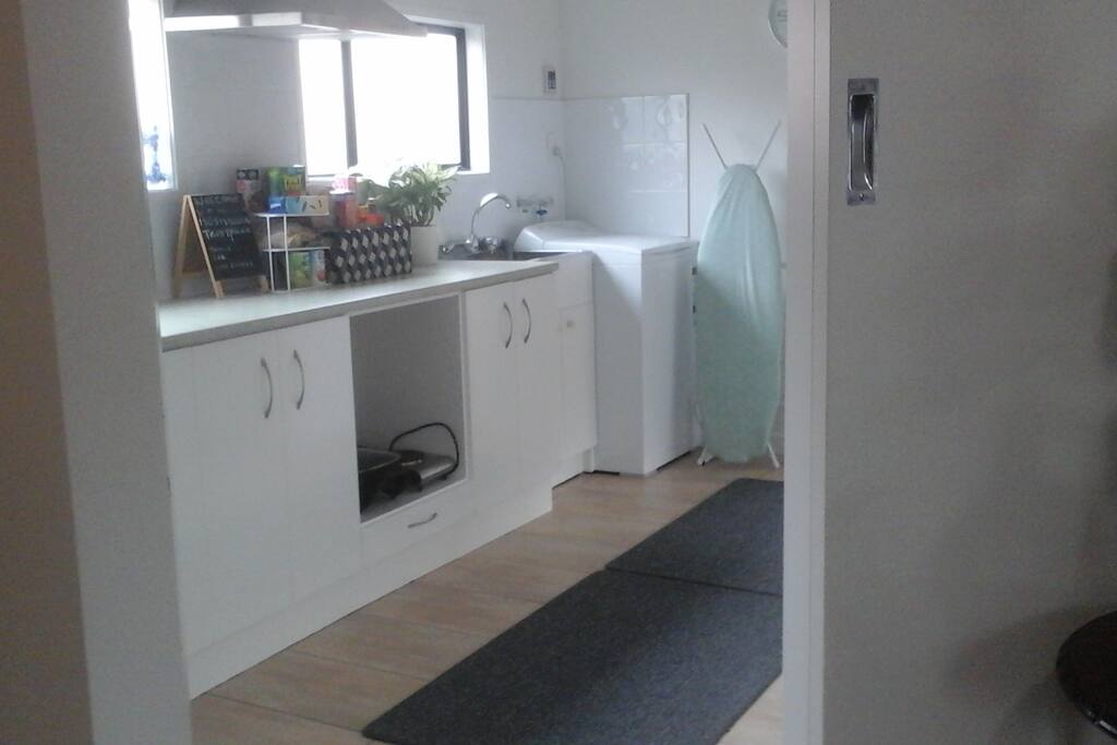kitchen , pleanty with cupboards with all the cook ware