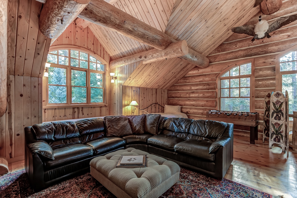 This loft room offers a comfortable couch and entertainment area as well as 2 twin beds. 