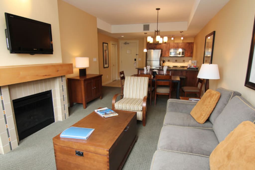 Relax in the cozy living area with a fireplace and flat screen TV.
