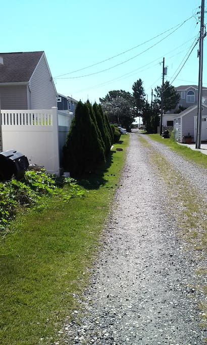 walking down the alley to the beach from your room