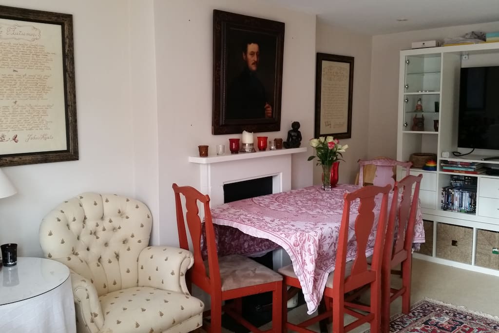 Sitting room, dining table and large TV