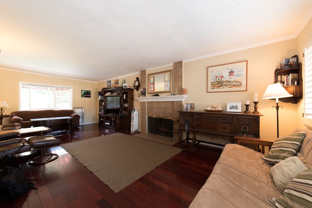 Living room with Sofa & Futon, 60" TV, mini Air Hockey table and entertainment system