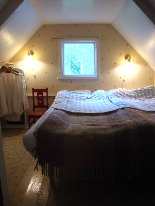 Bedroom 1, double bed, window towards the lake.