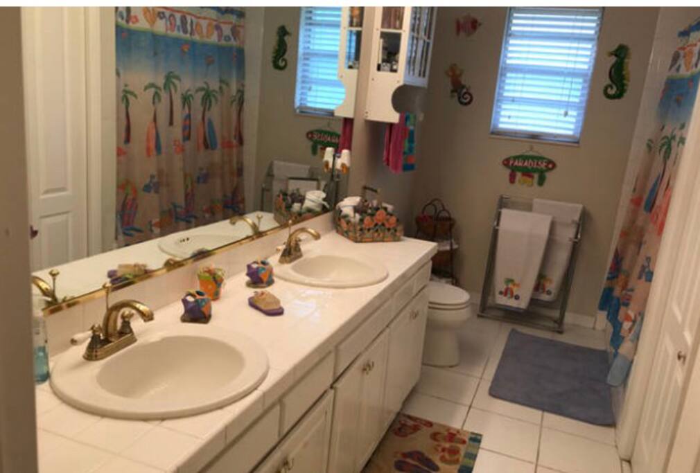 This big bathroom have two sinks a shower