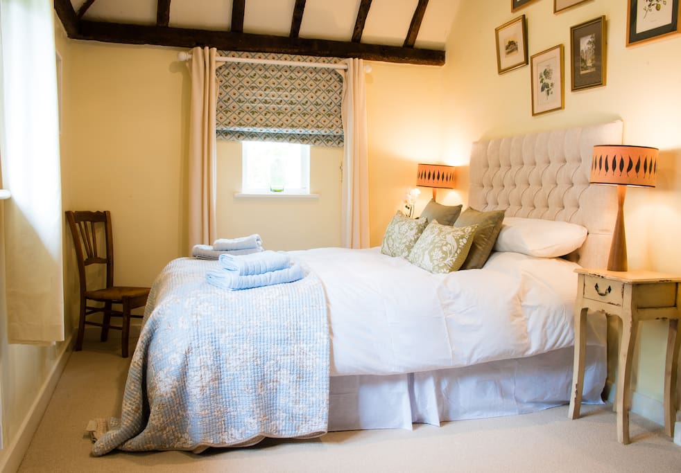 Main double bedroom with hanging wardrobe.