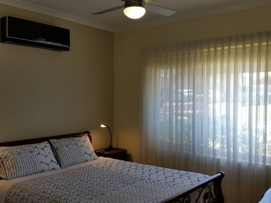 Bedroom One - queen size bed, reverse cycle air con, ceiling fan - all bed and bathroom linen is supplied