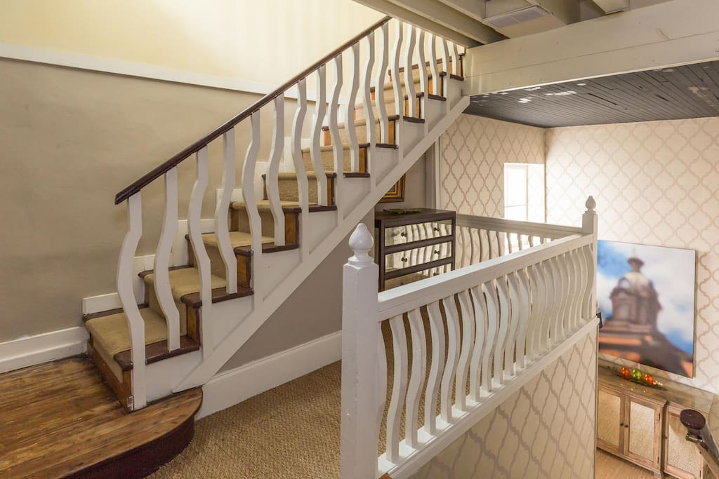 Stairs leading up to loft space from foyer