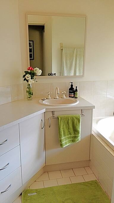 The bathroom with a shower, bath and a view