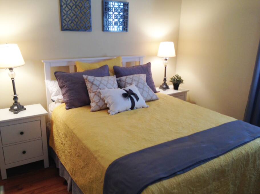 One of two Queen beds in 2BR apartment of compound.