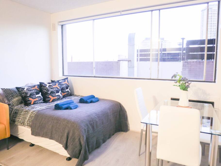 Bright spacious living area with large windows