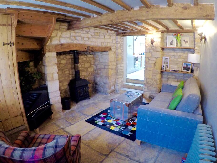The welcoming front room with hearth and log burning stove.