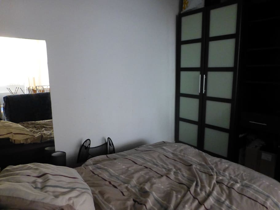 Inside the alcove with space for your clothe and a large bed.