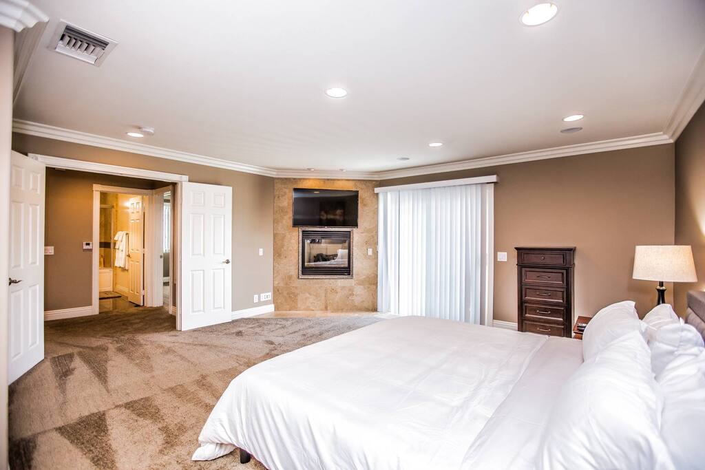 master looking toward fireplace and TV. 1st bedroom