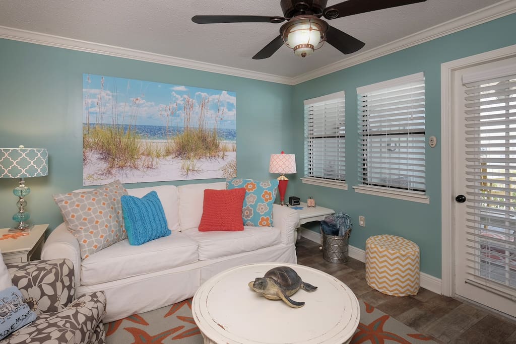 Living room to balcony - Gulf Beach, Pool and River views with amazing sunsets!